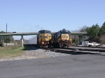 CSX 7693 with brand new hoppers from HOG yard passing local power